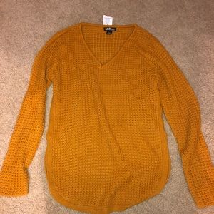 orange knit sweater